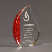 Color cast flame shaped acrylic award with red glitter acrylic cast on left side of flame.